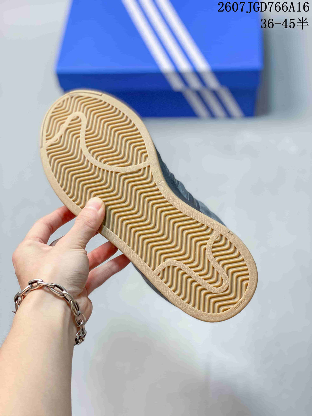 Close-up of the gum-colored outsole showing its patterned rubber tread.