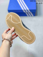 Close-up of the gum-colored outsole showing its patterned rubber tread.