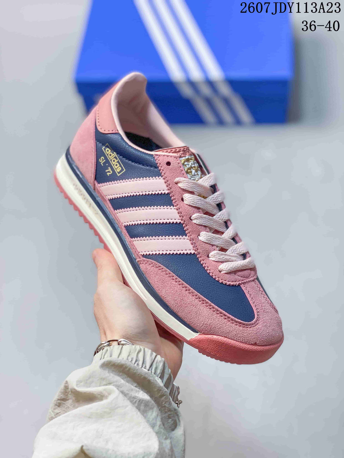 Pink and navy adidas SL 72 sneaker with white laces, contrasting side stripes, layered panels and a textured rubber outsole; image text shows style code 2607JDY113A23 and size range 36–40.