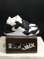 Side view of the black and white sneakers showing the layered upper, side branding, and textured outsole.