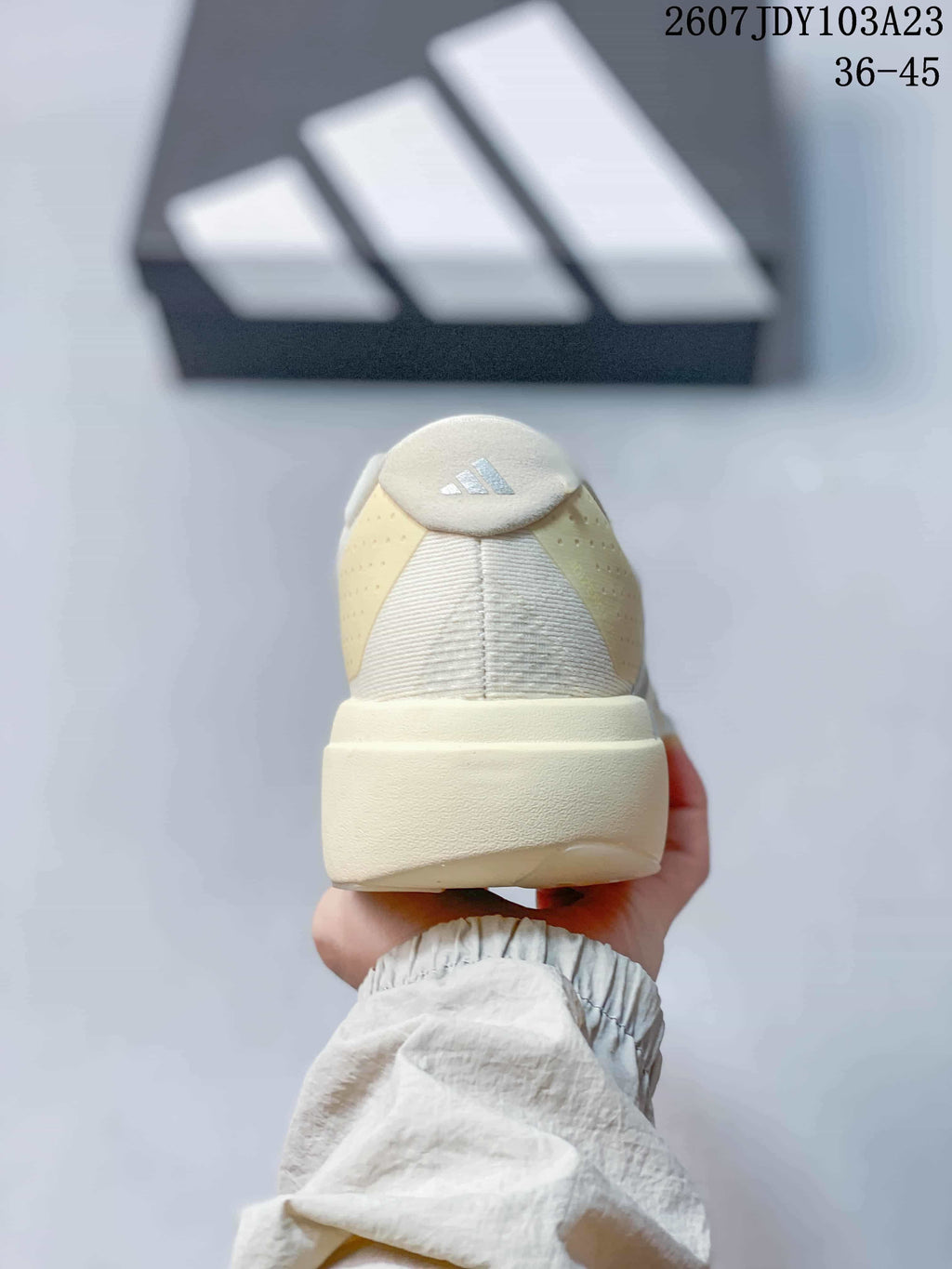Rear view of the sneaker showing the padded heel, textured heel panel and adidas logo detail.