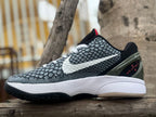 Opposite side view showing the patterned upper, white Swoosh, and heel detail