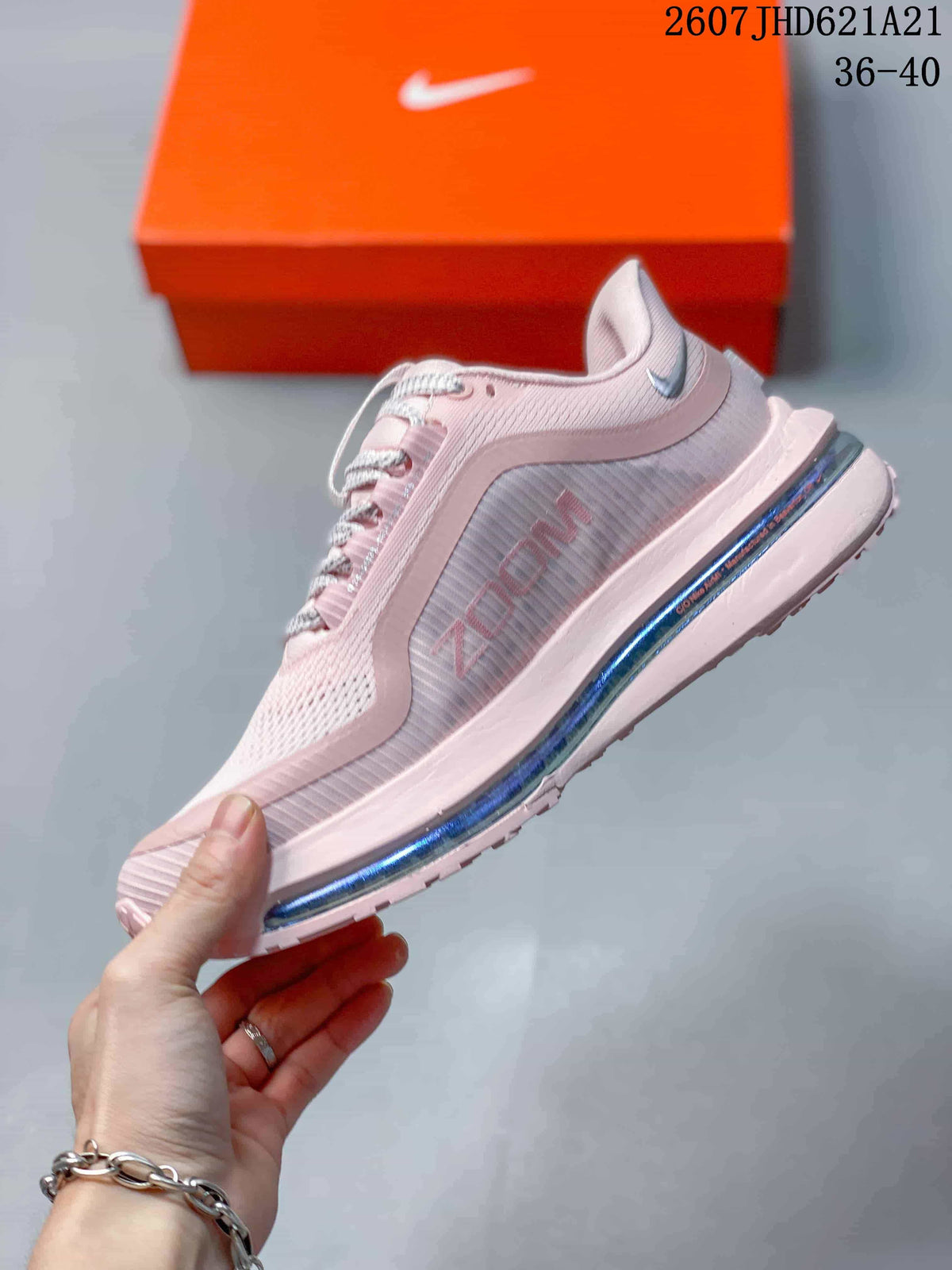 Side profile highlighting the pink layered upper, side branding and midsole air unit.