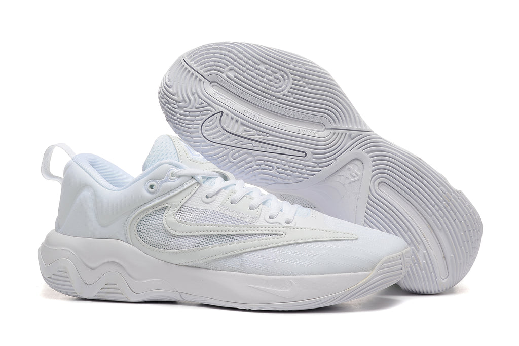 All-white basketball shoe with mesh panels and patterned outsole