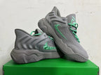Pair of grey Nike KD 4 basketball shoes with green accents, shown from the side