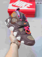 Dark gray Nike high-top sneaker with pink, orange and purple accents, patterned panels, laces and a hook-and-loop strap; style code 2607JVD416A16 and size range 40–45 are overlaid.