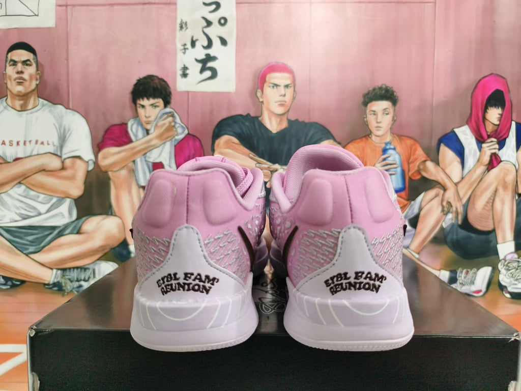 Rear view of pink and light gray basketball shoes with heel lettering