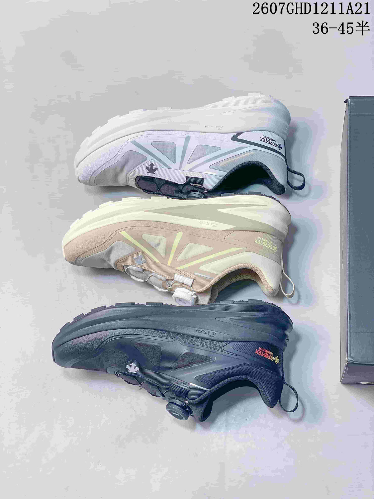 Three color versions of the DESCENTE sneaker arranged to show their side profiles and outsoles.