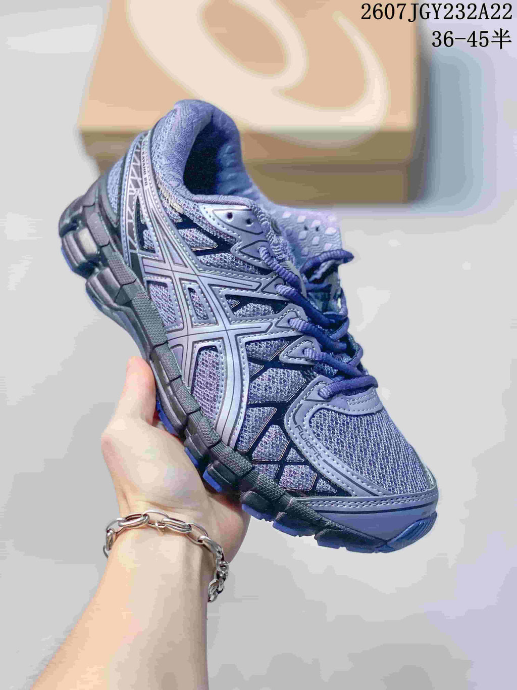 Three-quarter side view showing the purple and gray upper, layered overlays, and outsole.