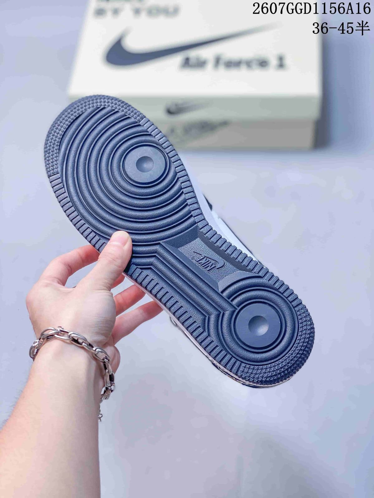 Close-up of the dark rubber outsole showing concentric traction circles and patterned perimeter tread.