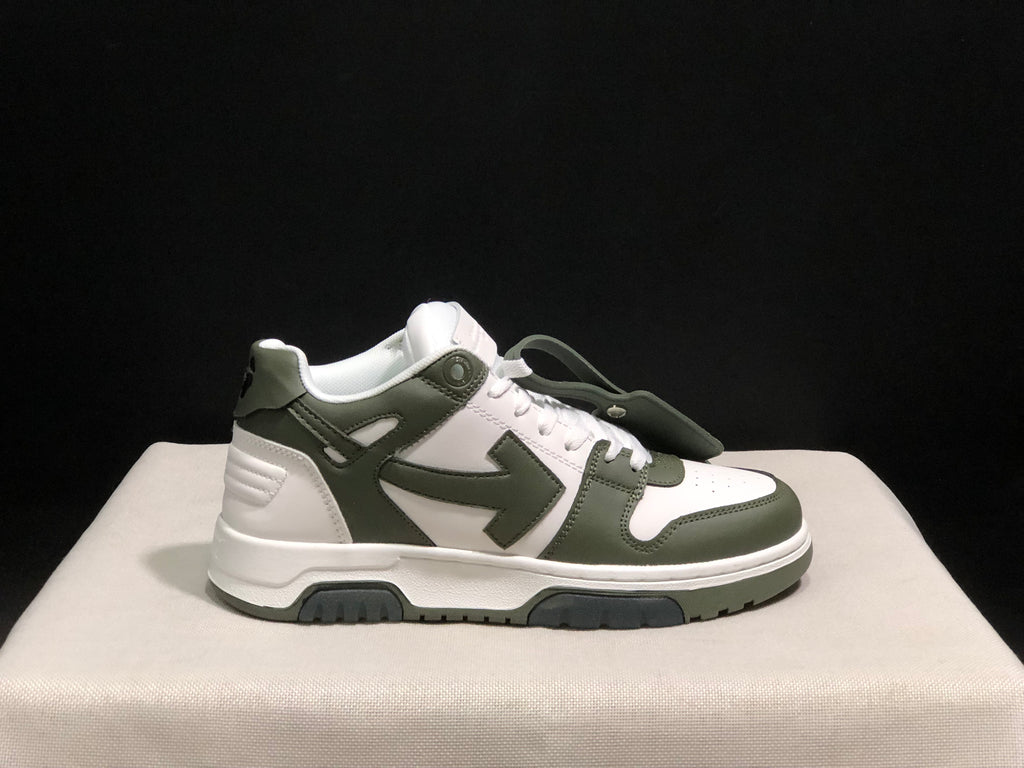 Single-shoe side view showing the white and olive color blocking, large side arrow graphic, and hangtag.