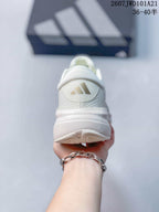 Rear view of the white sneaker showing the padded heel collar, Adidas heel logo and textured outsole edge.