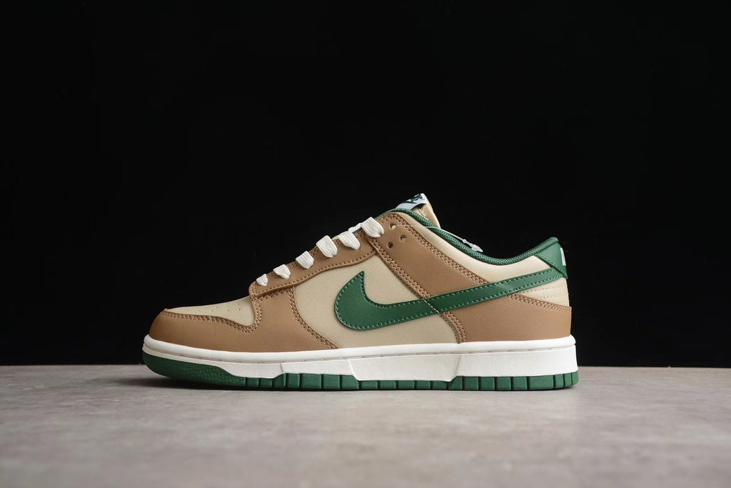 Full side profile showing the cream and brown panels, green Swoosh and heel details, white midsole, and green outsole.