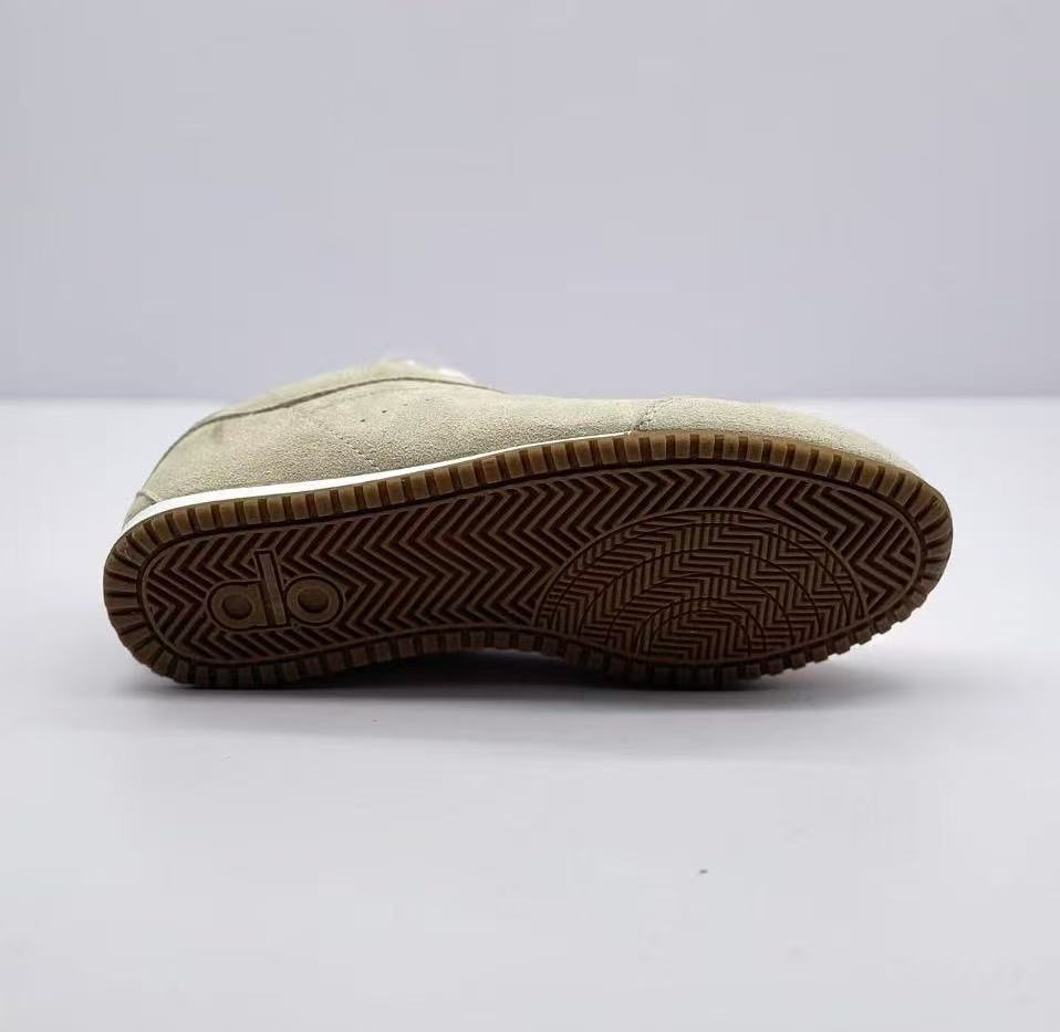 Underside view showing the brown patterned outsole and Alo logo detail.