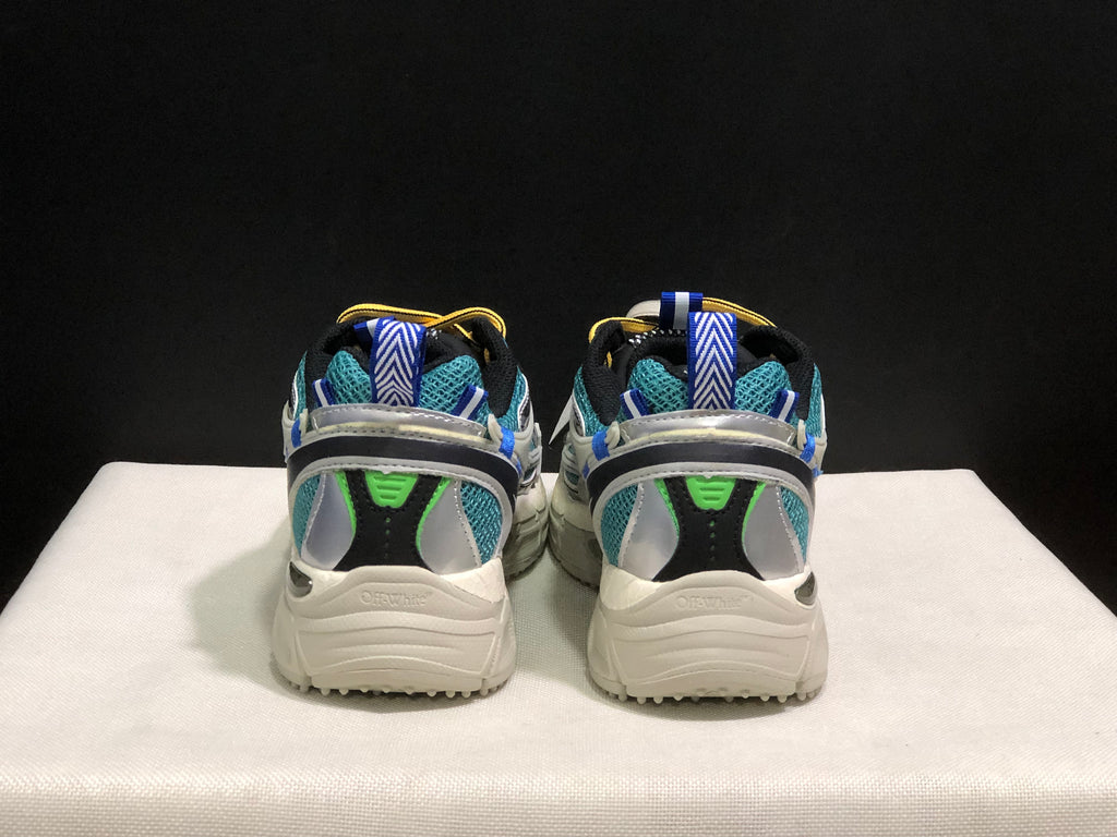 Rear view of the pair showing blue pull tabs, teal mesh, black heel panels, and chunky soles.