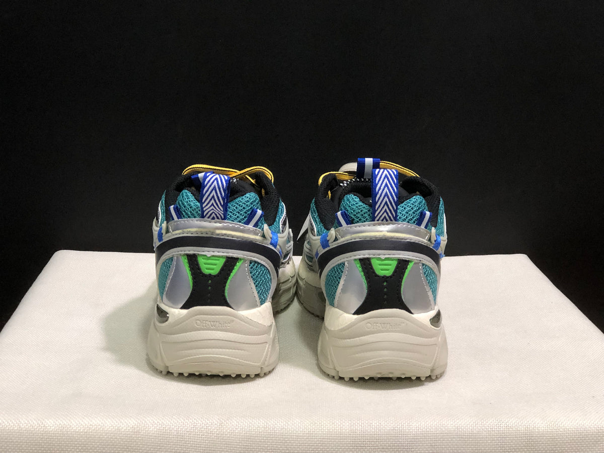 Rear view of the pair showing blue pull tabs, teal mesh, black heel panels, and chunky soles.