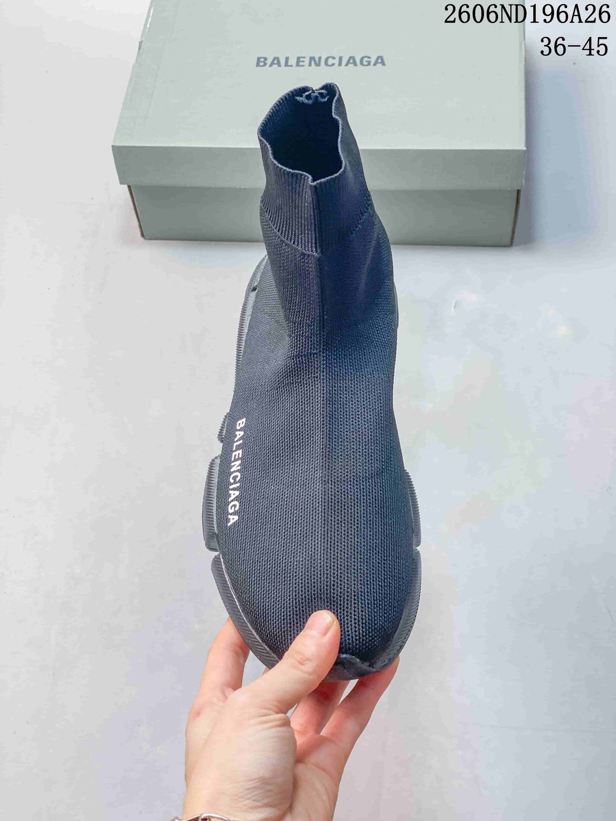 Top view of the dark gray sock sneaker showing the rounded toe, knit texture, and side branding.