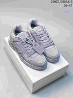 Pair of gray low-top lace-up sneakers displayed on a white shoebox; image text shows style 2607HJD305A15 and size range 36–47.