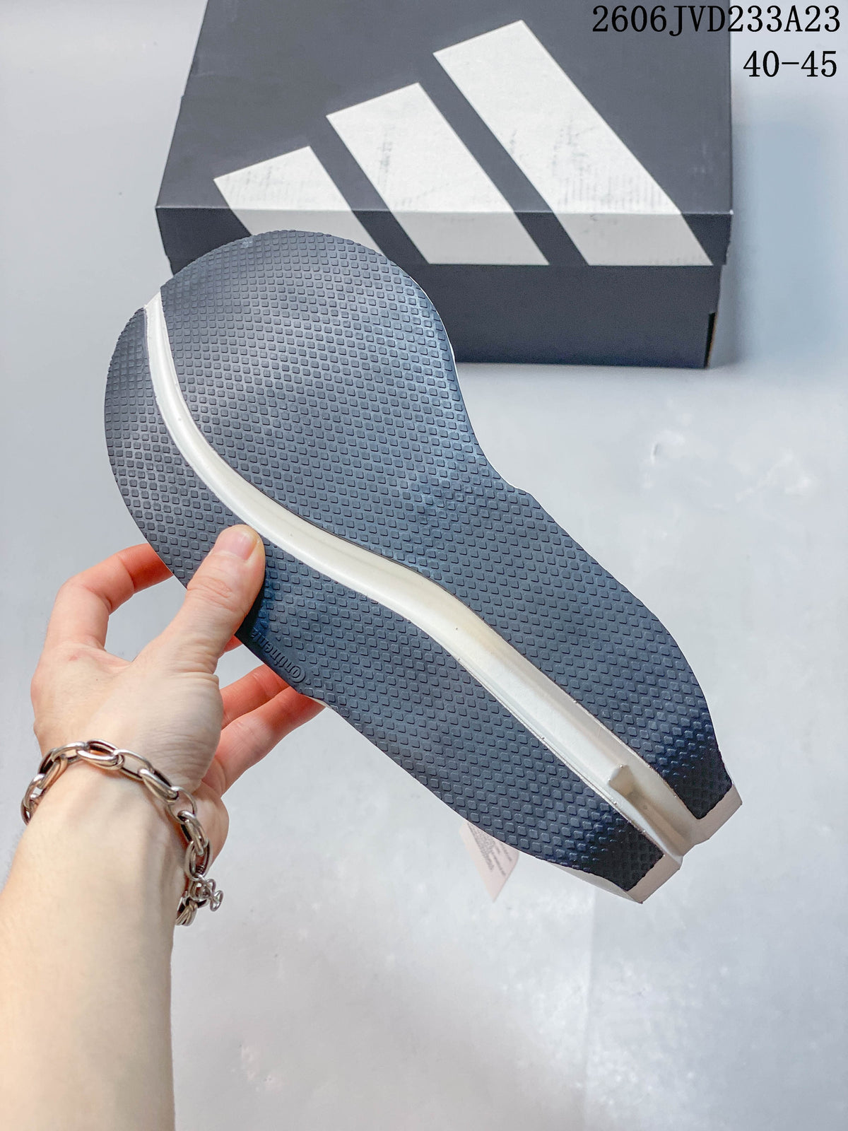 Close-up of the dark textured outsole and white midsole