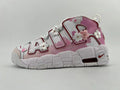 White and pink Nike Air More Uptempo sneaker with floral appliqués and a chunky sole