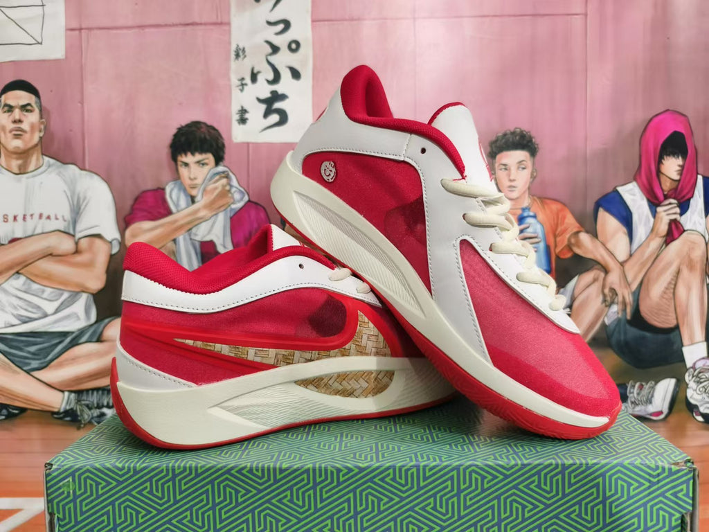 White and red Anta KT 10 basketball shoes shown together from the side