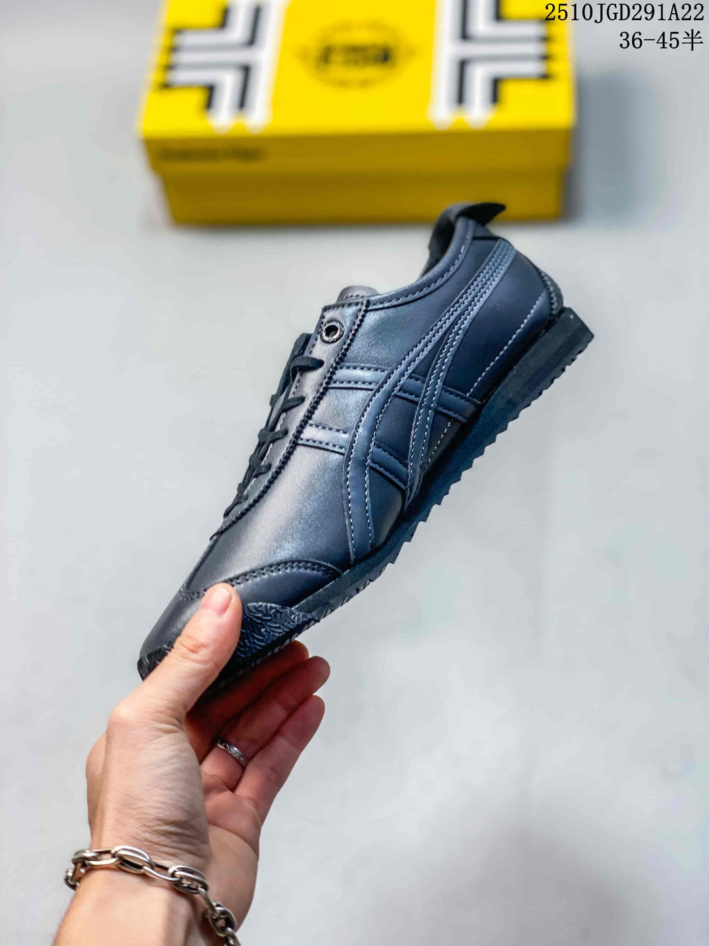 Side view of the black low-top sneaker showing layered stripes, stitched panels, and textured outsole.