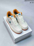 Pair of white Nike Air Force 1 ’07 LV8 low-top sneakers with teal Swooshes, orange collars, orange outsoles, and a white shoe box; image text shows 36–45.