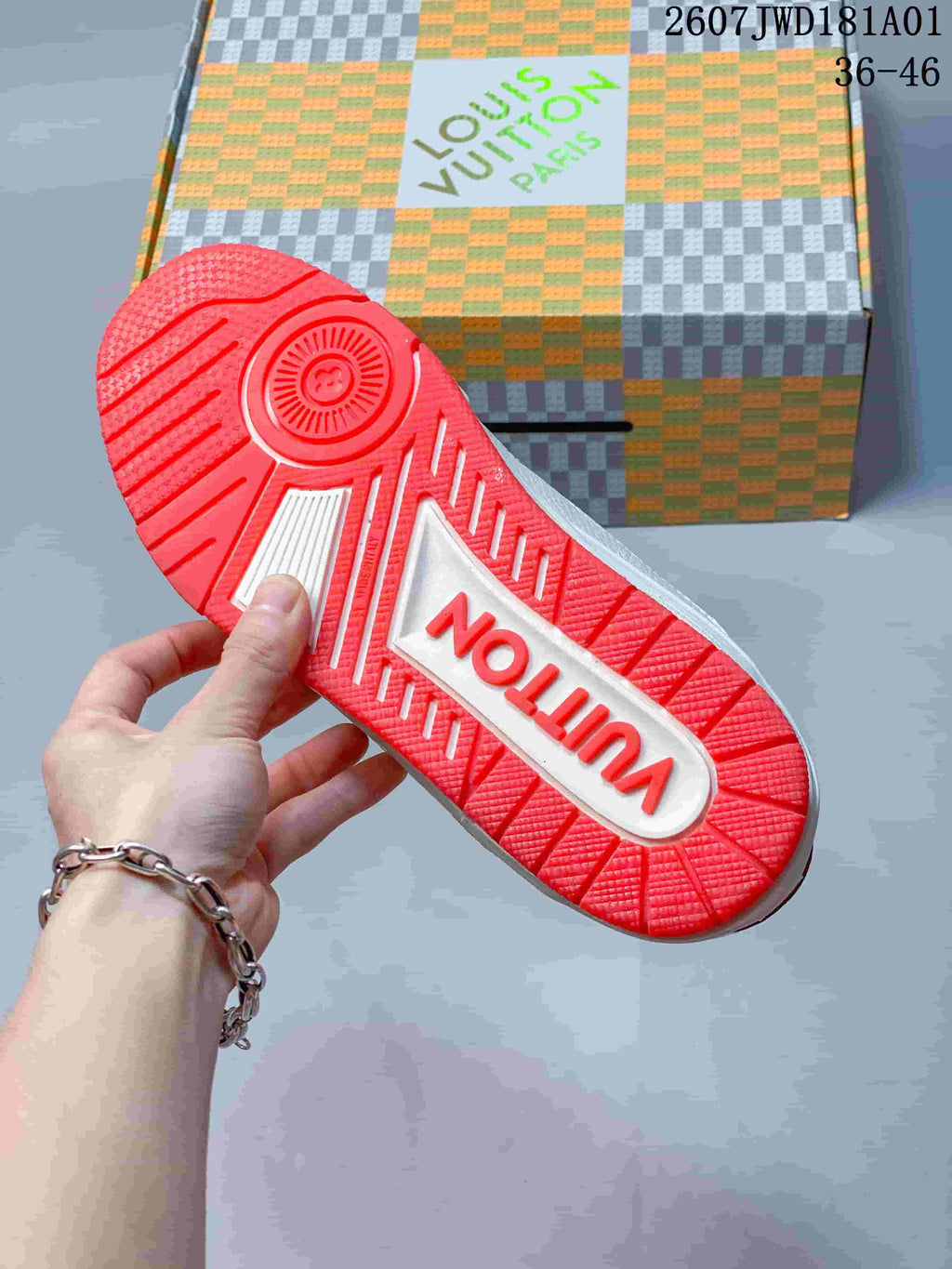 Bright red outsole shown on a white and red sneaker