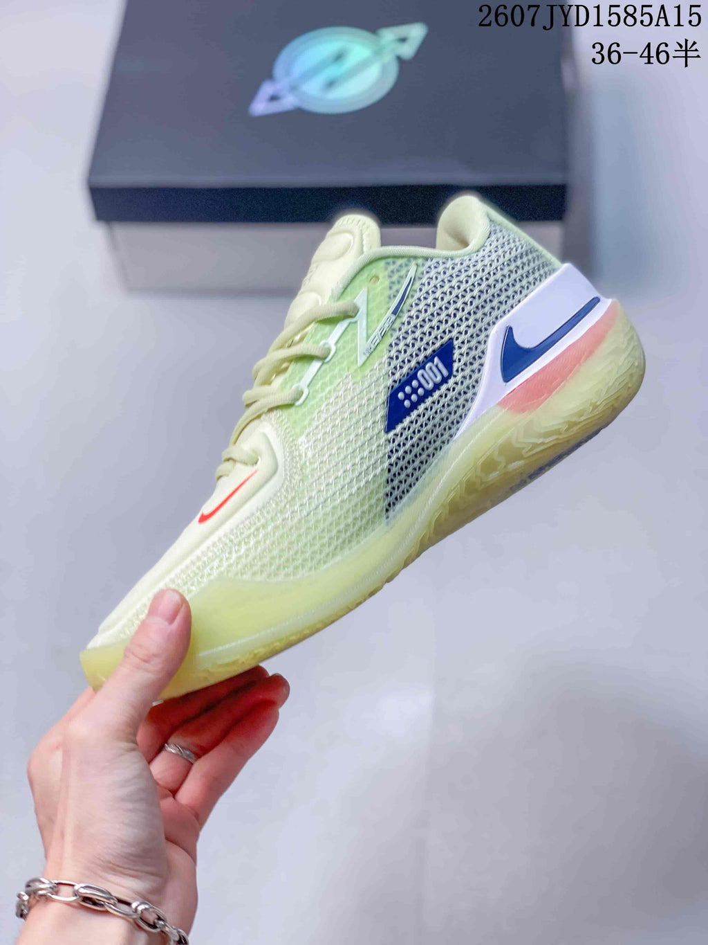 Side view of the pale cream and light green basketball shoe showing mesh panels, blue swoosh details, and the translucent outsole.