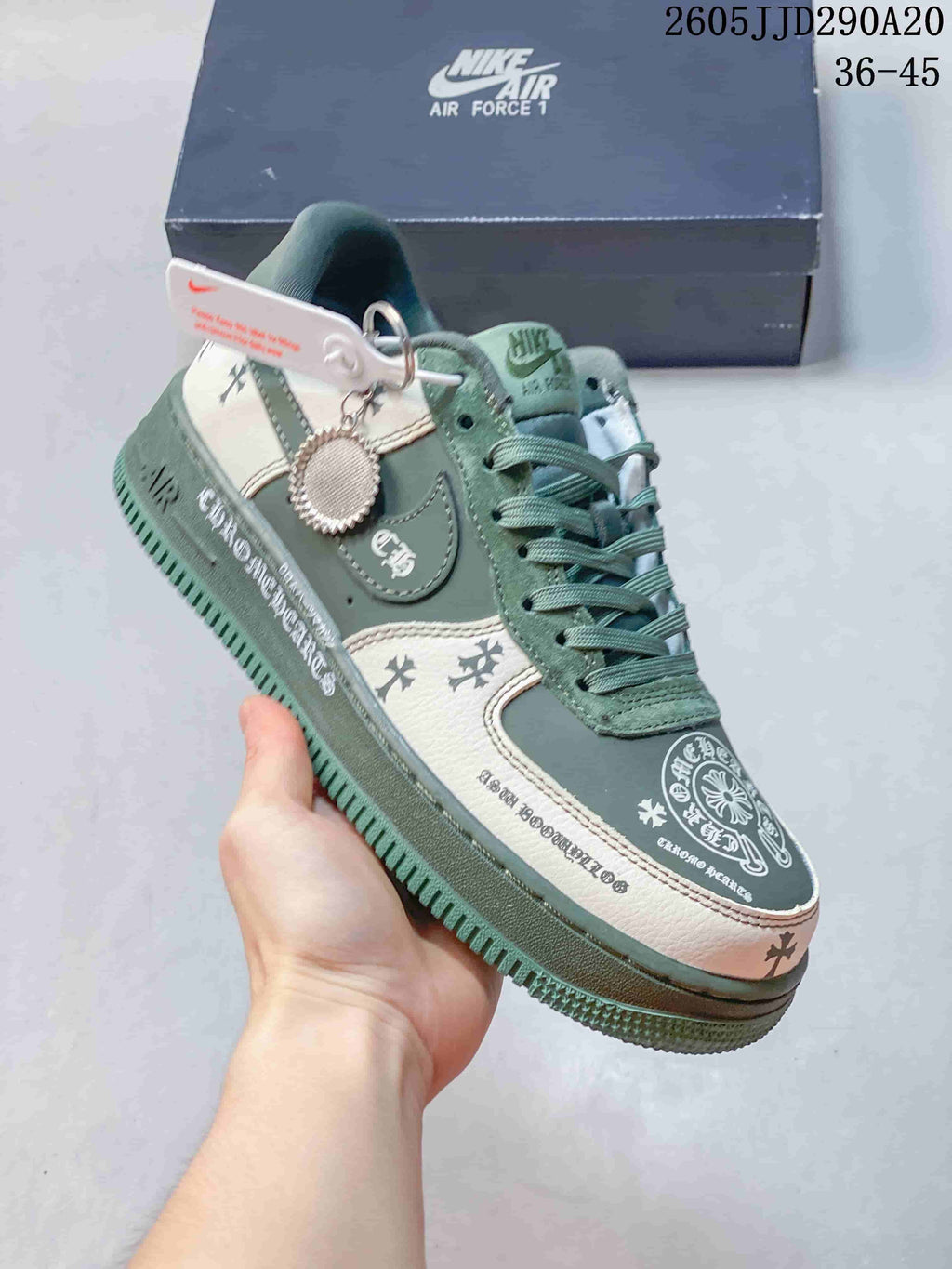 Angled close view showing the green and white upper, decorative side graphics, laces, and layered sole.