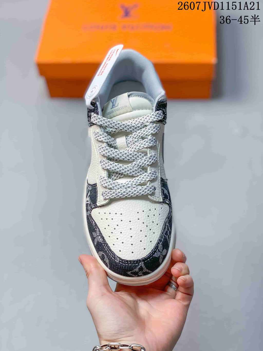 Top view showing the perforated white toe box, patterned toe overlay, and woven laces.