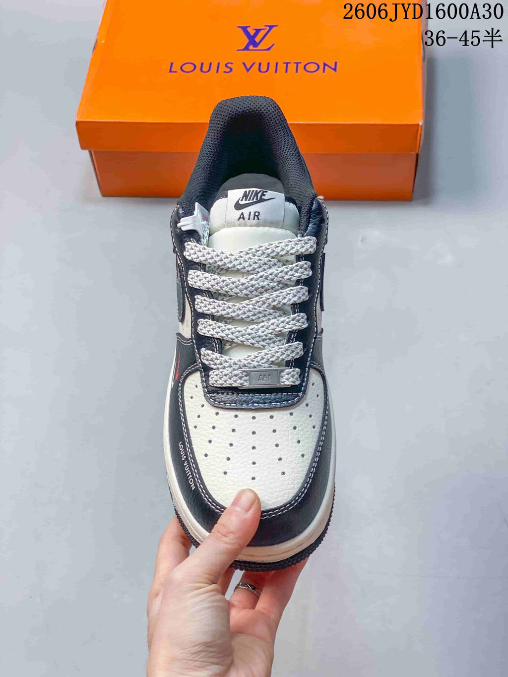 Top view showing a perforated white toe, thick laces, and navy overlays