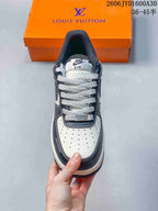 Top view showing a perforated white toe, thick laces, and navy overlays