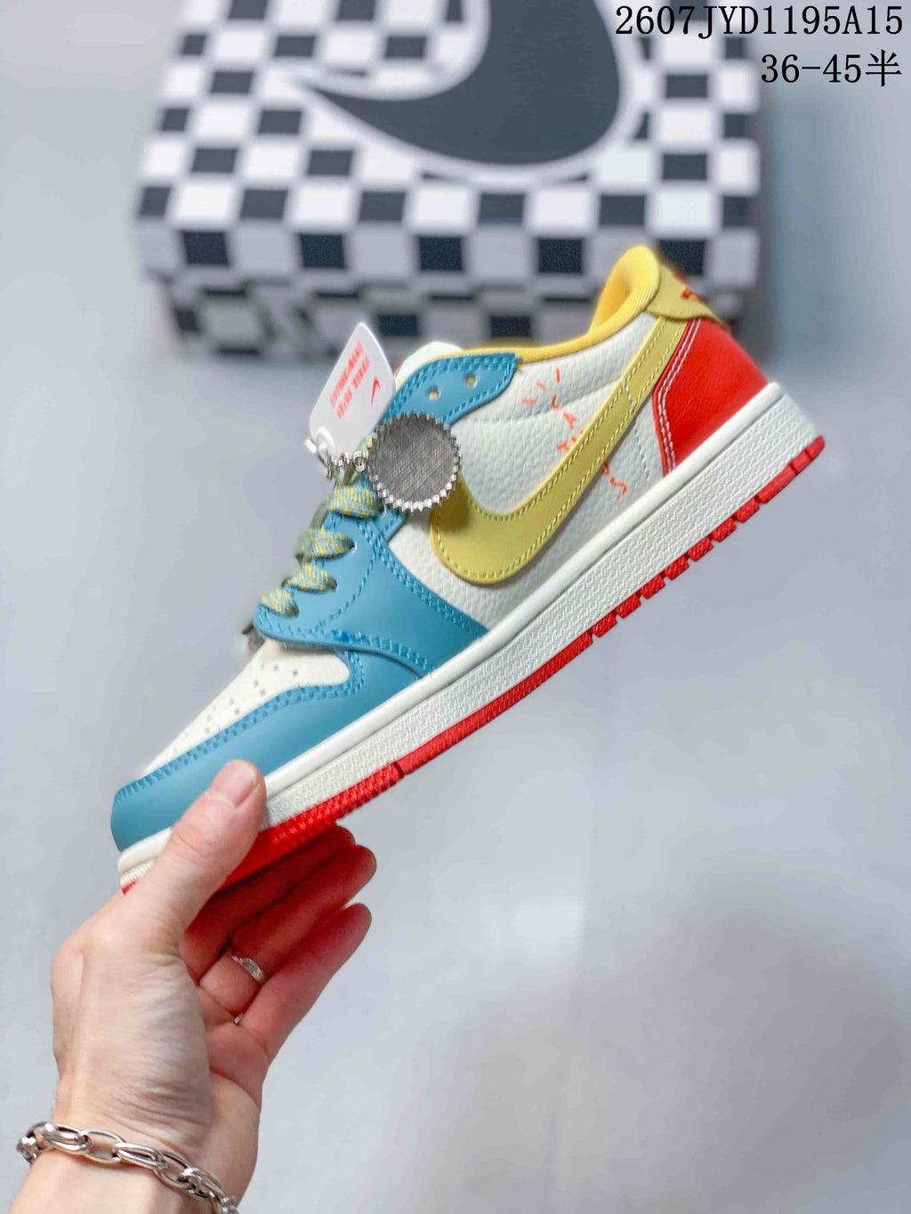 Side profile showing the blue forefoot, yellow side detail, white upper, red heel, white midsole, and red outsole.
