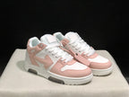Three-quarter front view of the pair with white laces, pale pink overlays, and extra pink strap detail.