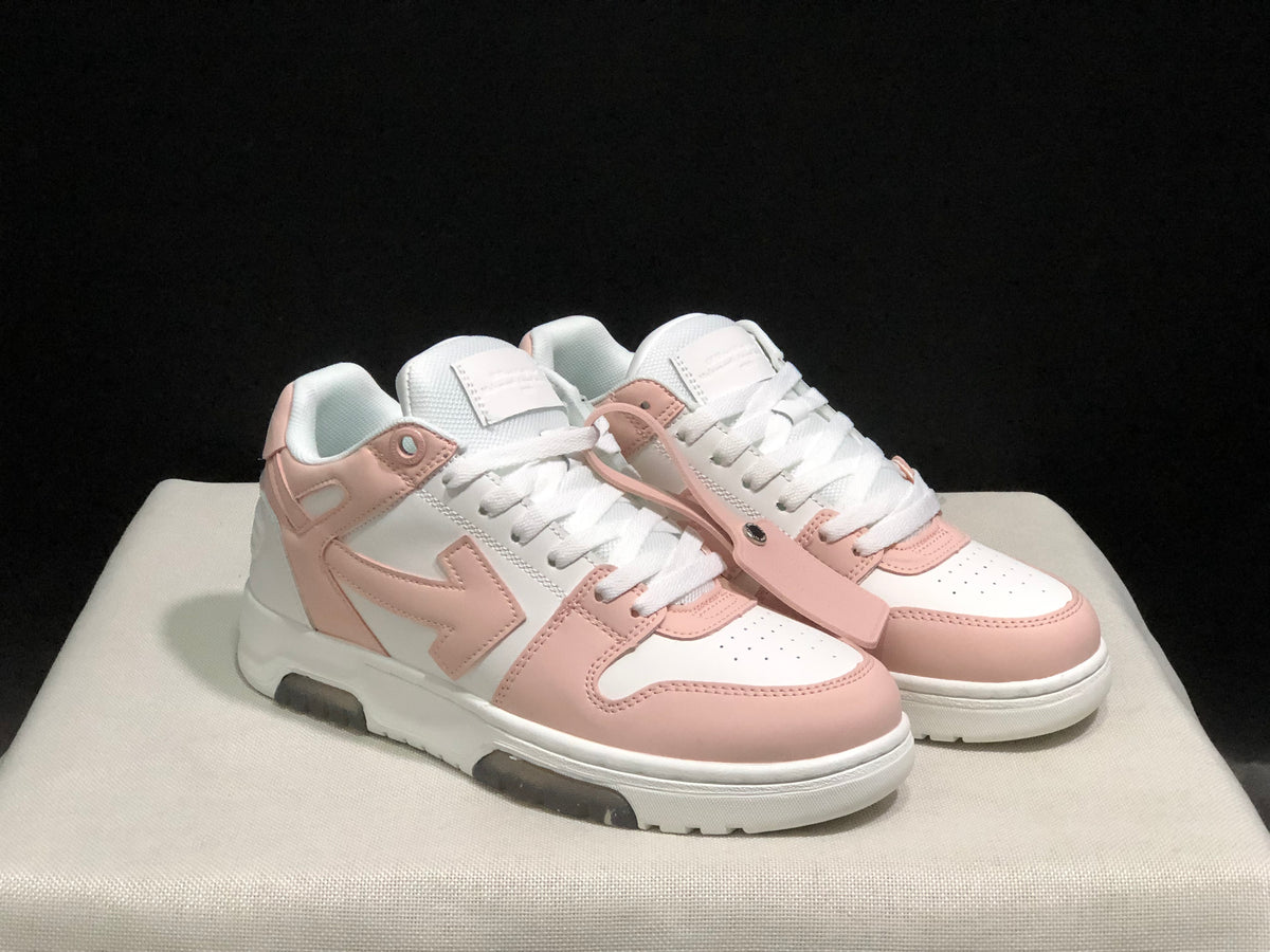 Three-quarter front view of the pair with white laces, pale pink overlays, and extra pink strap detail.