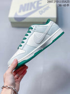 Side profile showing the white upper, stitched Swoosh, green lining, and green outsole.