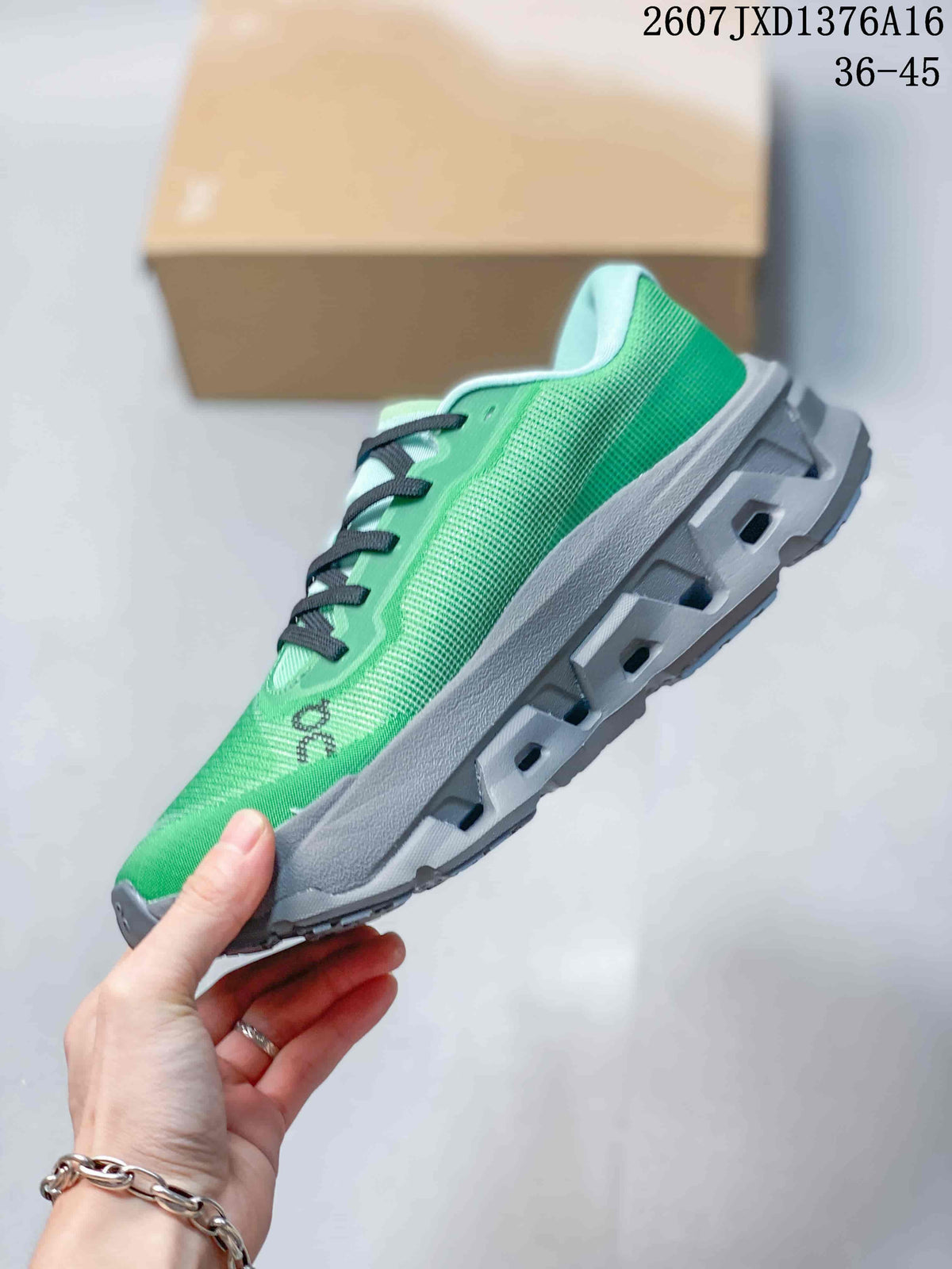 Side profile of the green sneaker showing the textured upper, black accents, and segmented gray sole.