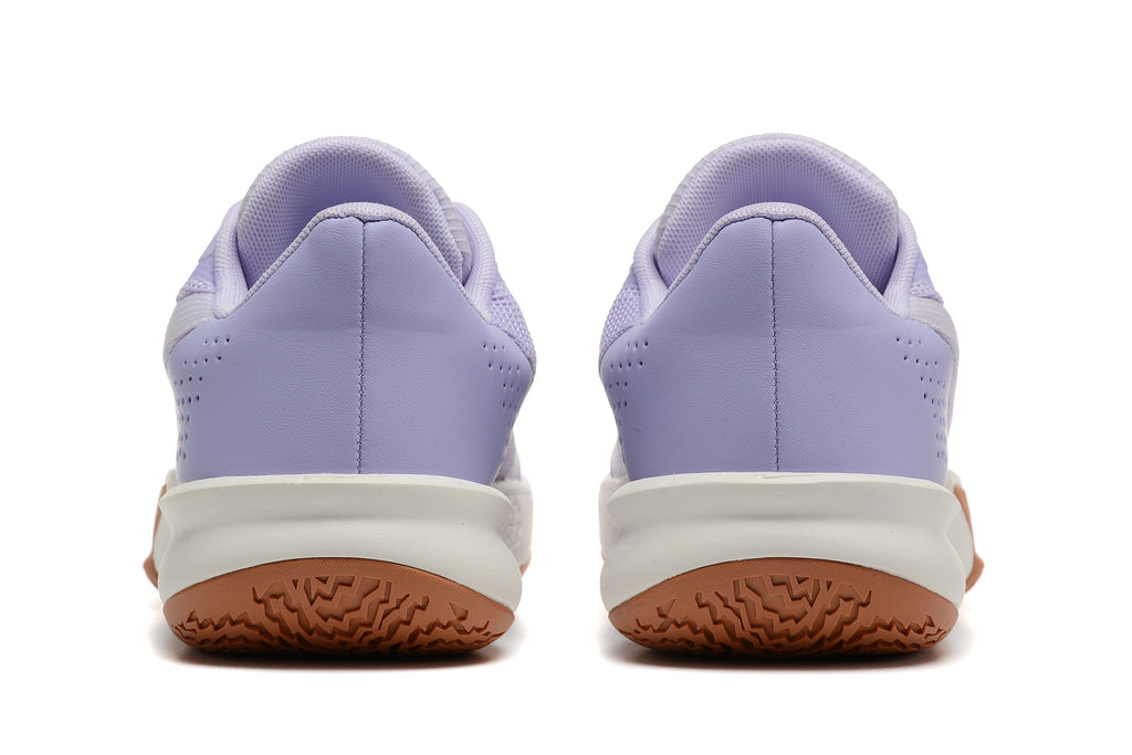 Rear view of the lavender basketball shoes, showing perforated heel panels and gum-colored outsoles.