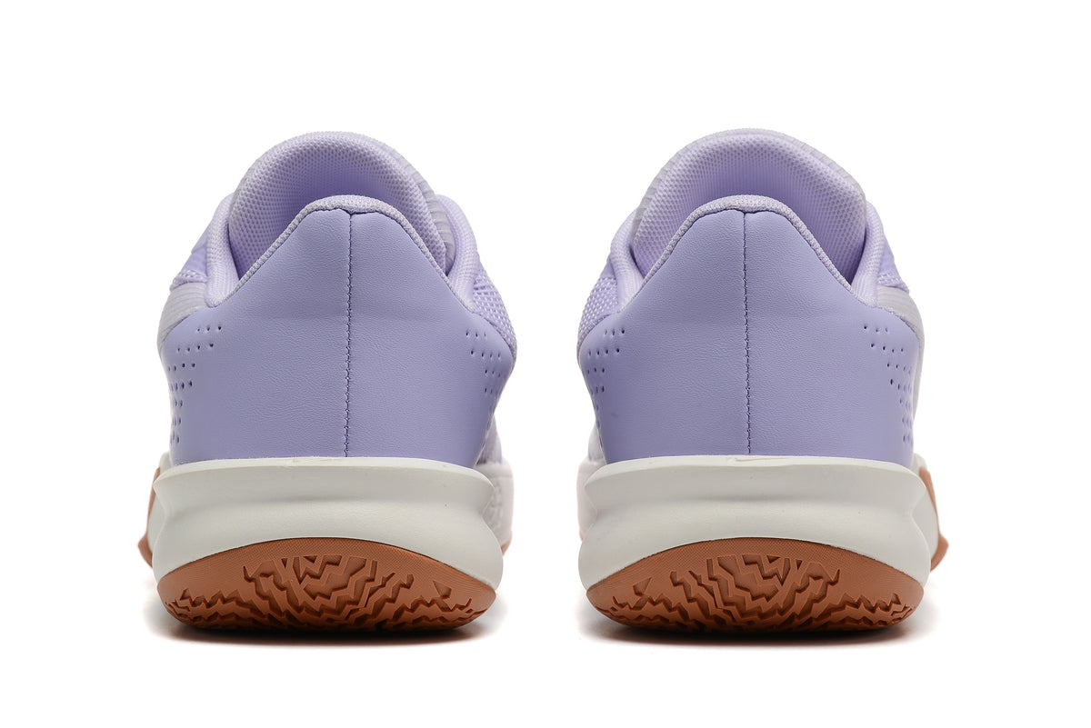 Rear view of the lavender basketball shoes, showing perforated heel panels and gum-colored outsoles.
