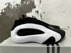 Side profile showing the sculpted white side panel and black upper.