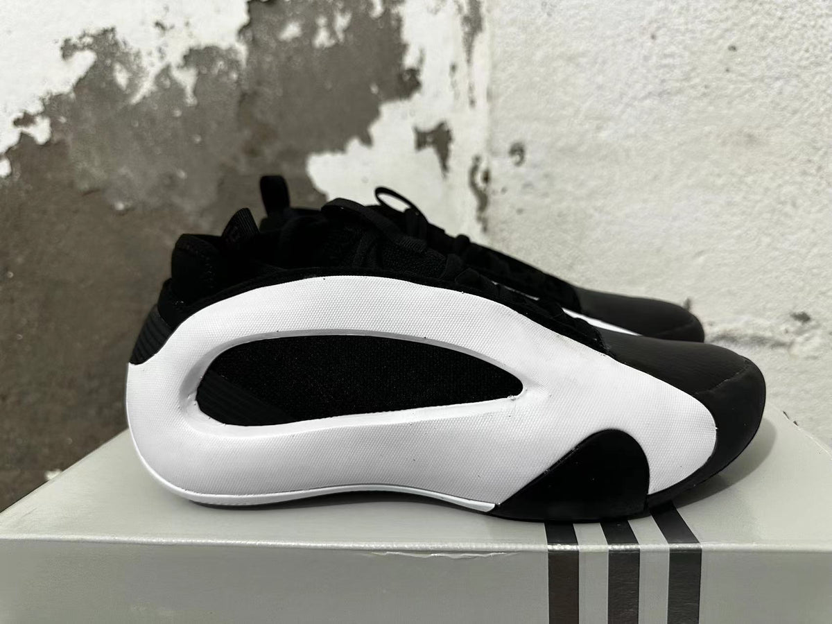 Side profile showing the sculpted white side panel and black upper.