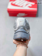 Rear view showing the padded heel, layered upper, and sculpted outsole of the sneaker.