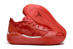 Side view of red Jordan Luka 39 shoes with outsole visible