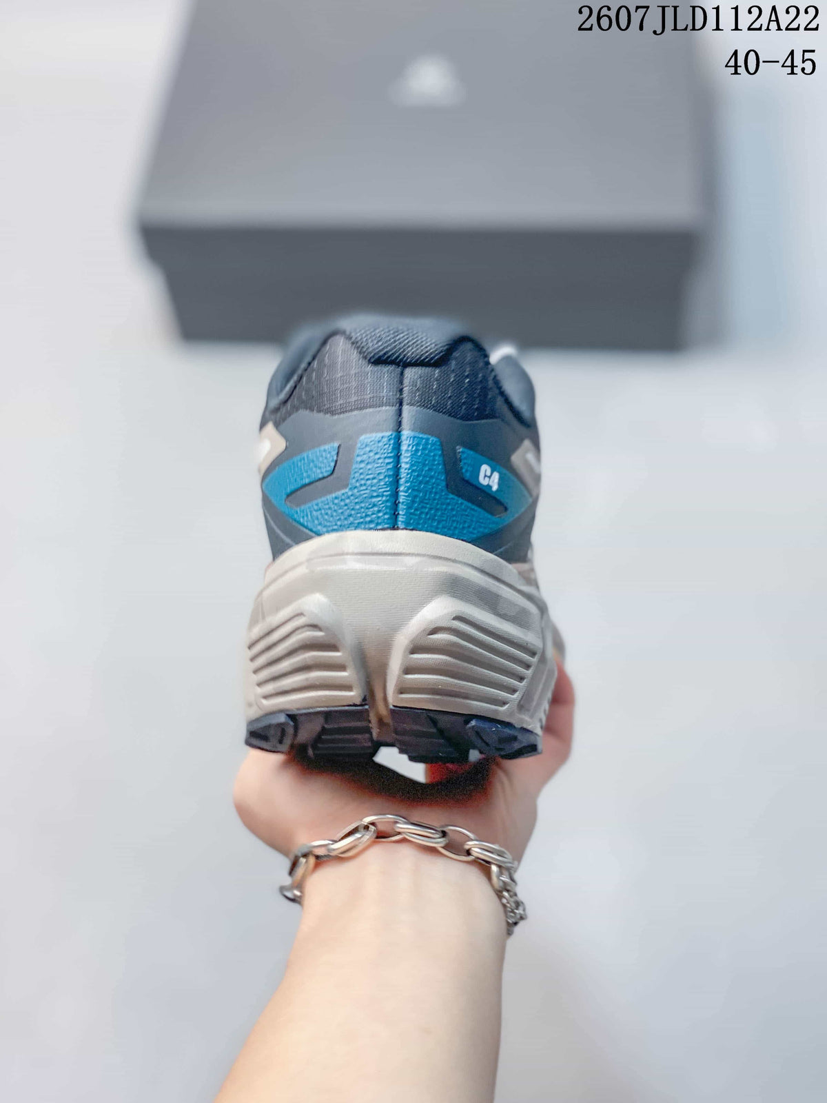 Rear view of the Kailas C4 shoe showing the blue heel detail, C4 marking, structured heel, and lugged outsole.