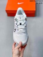 Top view showing the white laces, padded tongue, and textured forefoot.