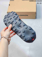 Close-up of the Salomon Ultra Glide 4 outsole showing its lugged tread pattern.