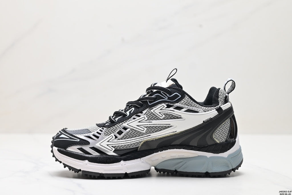 Single sneaker in profile showing the grey mesh upper, black overlays, white graphics, and pale blue-grey sole.