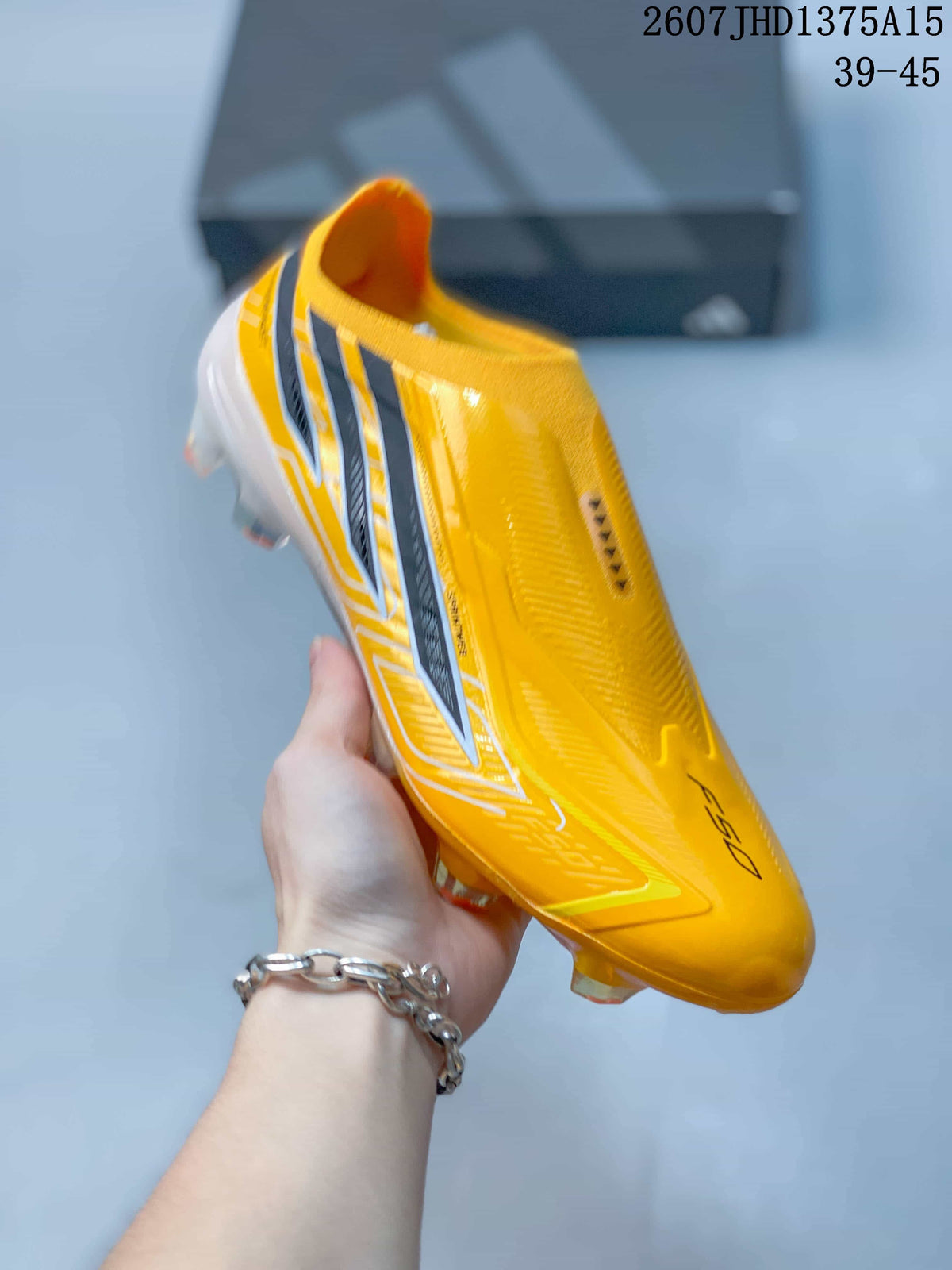 Angled side view of the yellow and black F50 cleat with its streamlined upper and translucent outsole.
