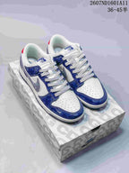 Pair of blue and white low-top sneakers displayed on a patterned shoe box, with visible Nike and The North Face branding.
